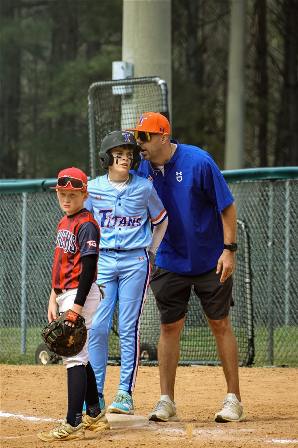 Garrett coaching travel baseball